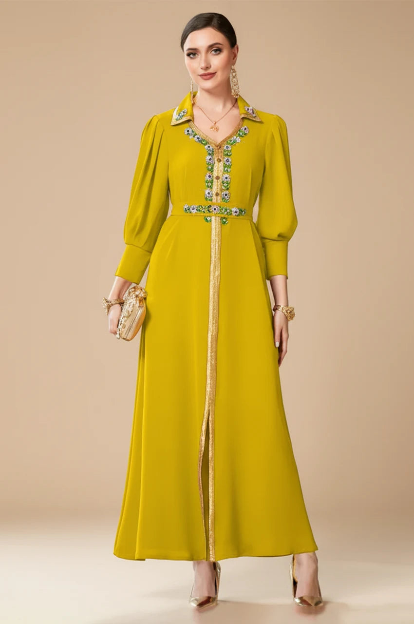 Full body shot of the Karia green Moroccan kaftan dress with gold accents, perfect for elegant wedding guest attire.