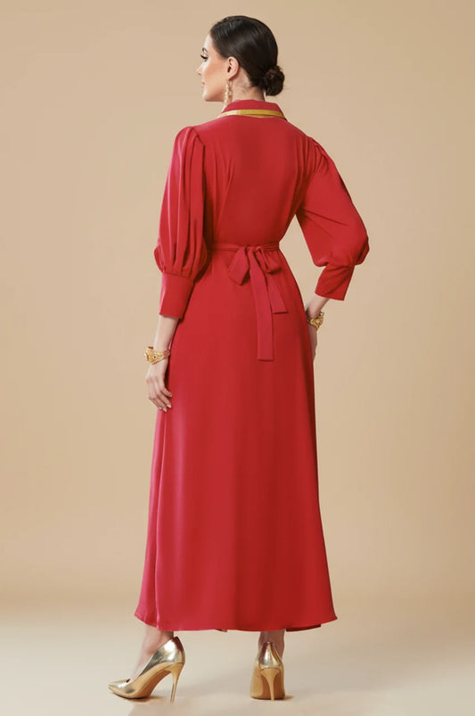 Back view of Karia ruby red modest evening gown featuring bishop sleeves and a matching tie-belt for a fitted silhouette.