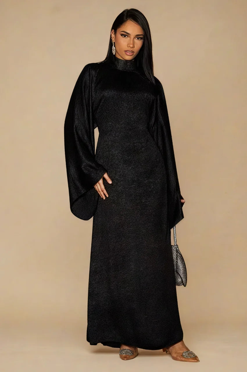 Kehlia metallic black kaftan front view with high neckline and dramatic draped sleeves