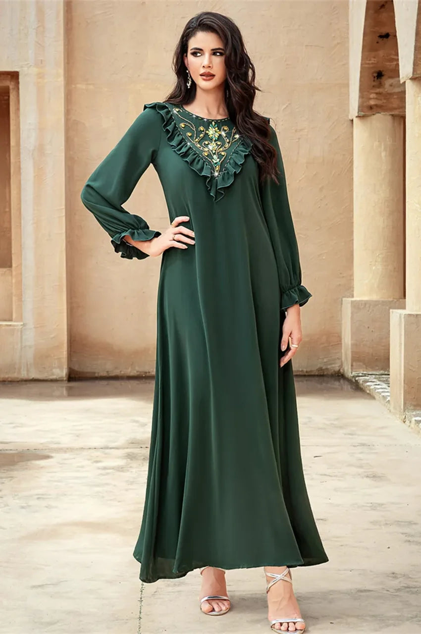 Elegant pose in Kenza emerald embellished kaftan