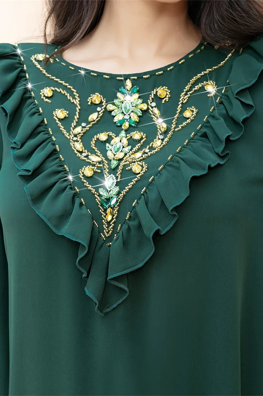 Close-up front of Kenza emerald embellished kaftan neckline