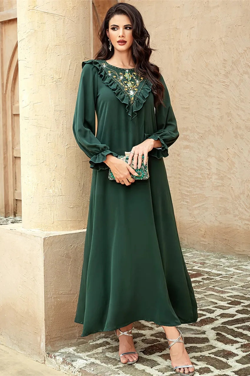 Side view flow of Kenza emerald maxi dress