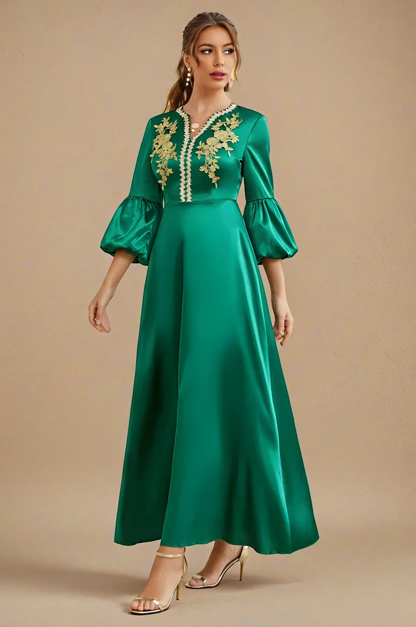 Kiara emerald green kaftan with gold floral embroidery and satin finish, front angled view