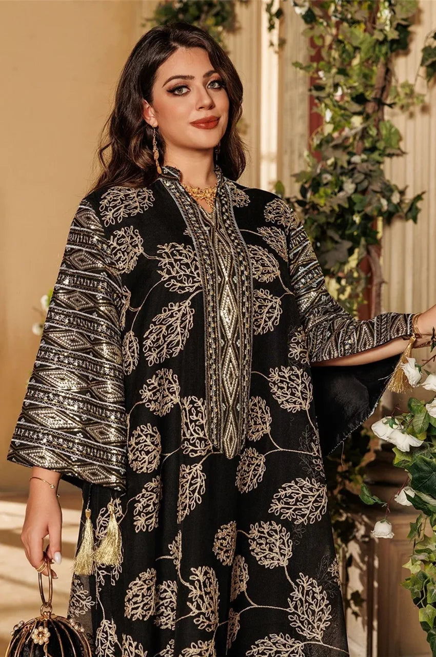 Close-up of black Leena Persian kaftan with silver and gold embroidery