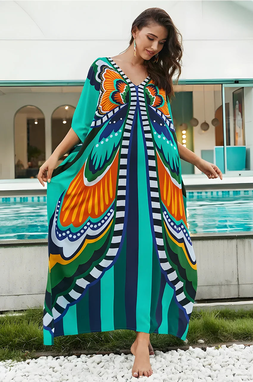 Model wearing gray boho kaftan by the pool with butterfly print design