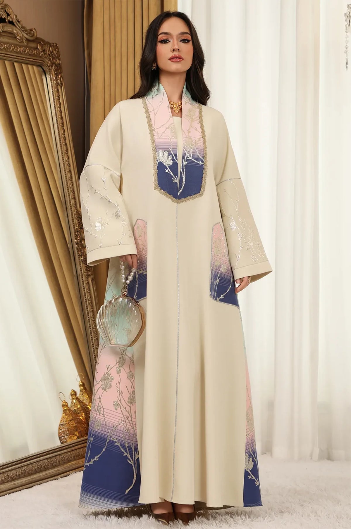 Model styled in the Liorra Dark Blue Kaftan Ombre holding a shell-shaped luxury clutch, perfect for formal party events.
