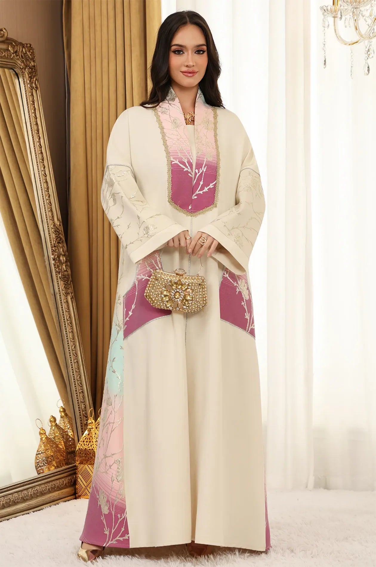 Model styled in the Liorra Pink Kaftan Ombre holding a luxury gold crystal clutch, showcasing a perfect formal evening look for Naylara.