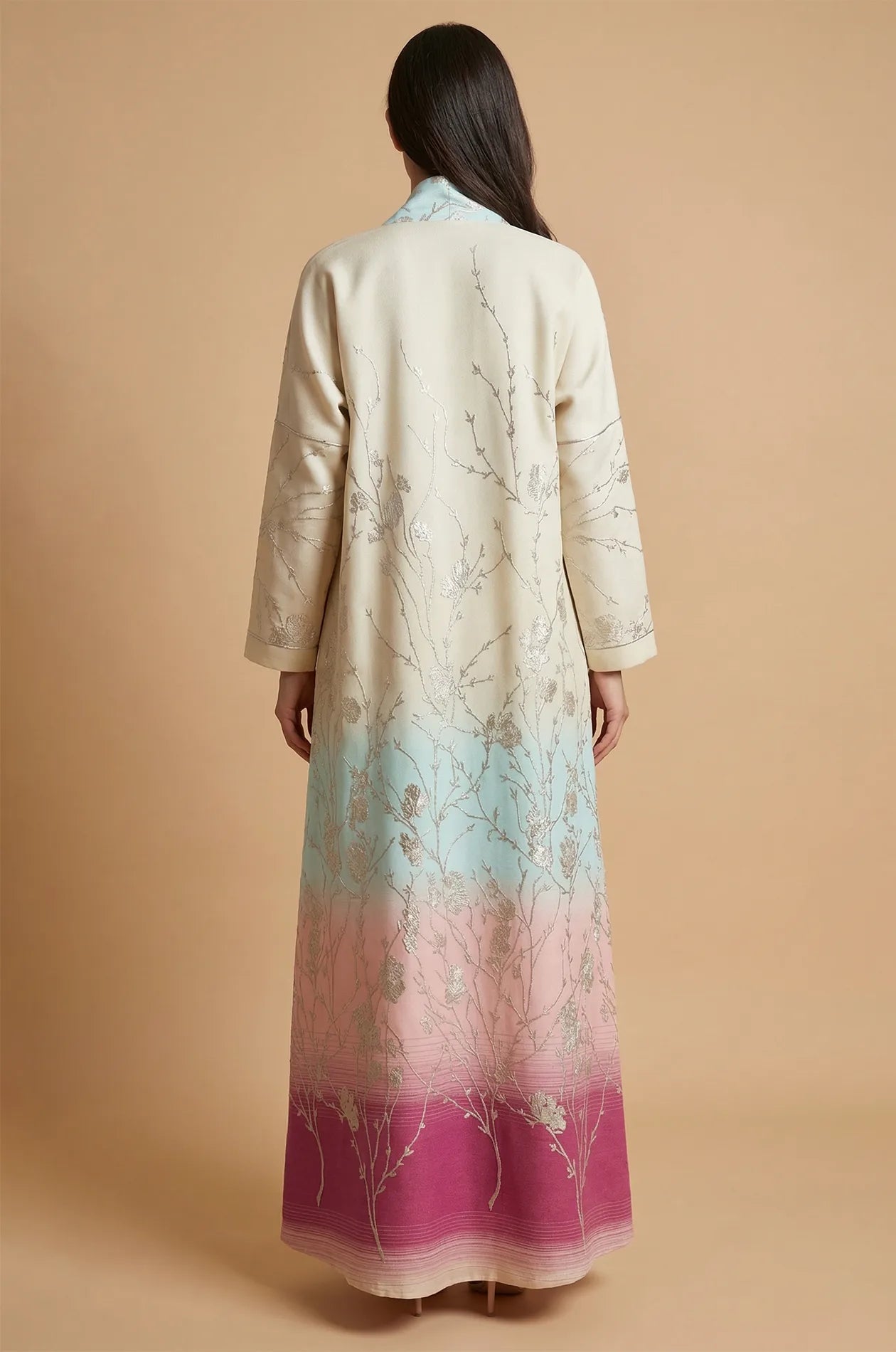 Rear view of the Liorra Pink Kaftan Ombre showing the sunset-inspired gradient from cream to deep magenta with gold floral branch embroidery.