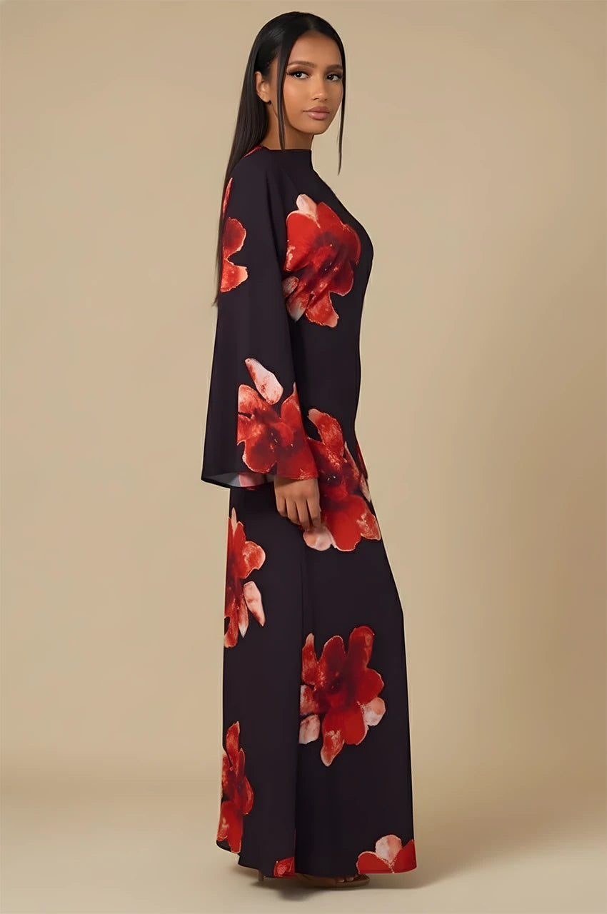 Side view of Liyana black floral print kaftan featuring bold red floral patterns