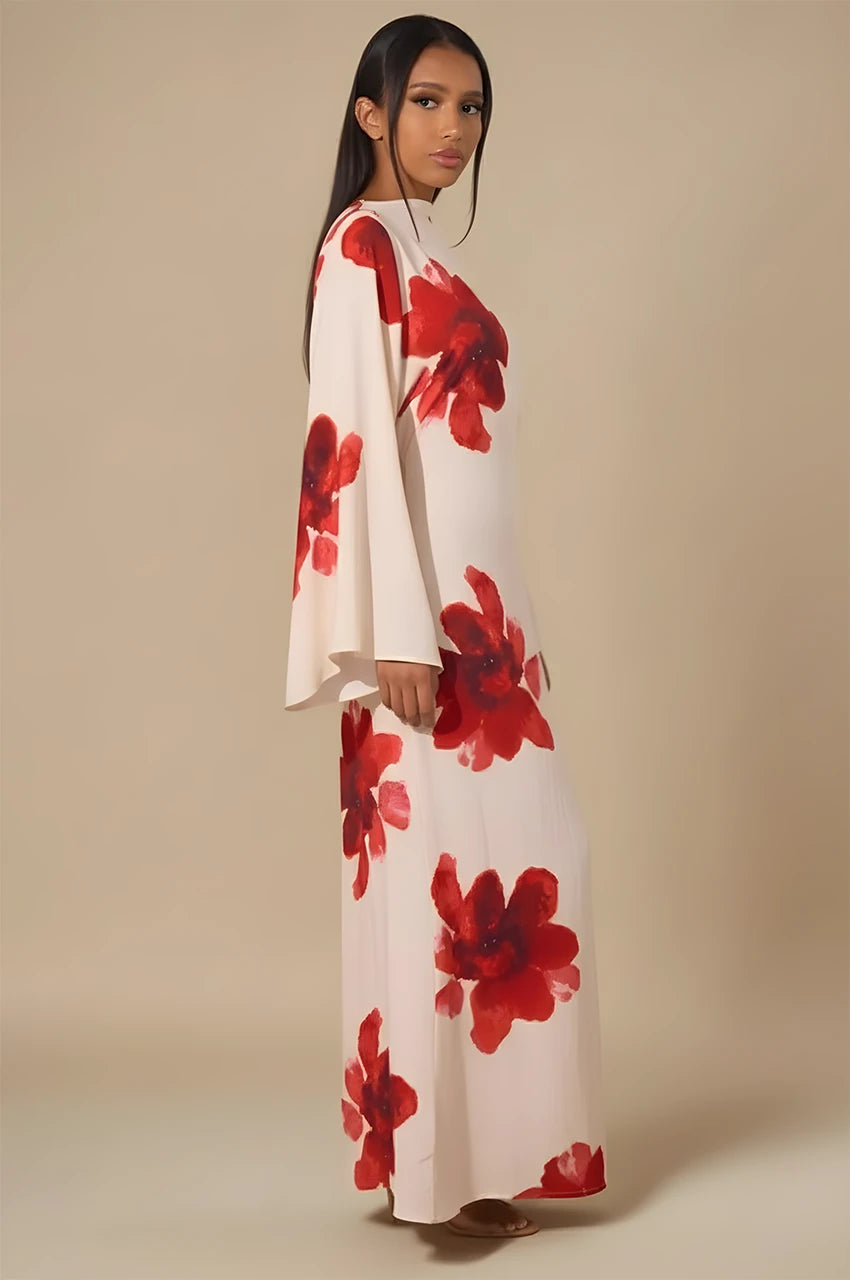 Side view of Liyana white floral print kaftan with bold red blossoms and flow sleeves.