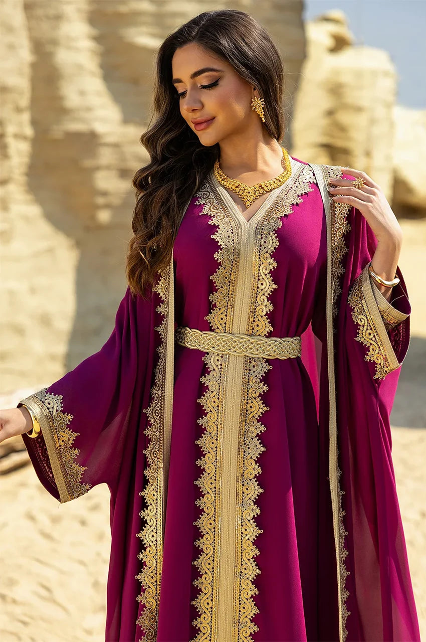 Close-up of the gold Sfifa braided lace on the cuffs of the hot pink long sheer kaftan.