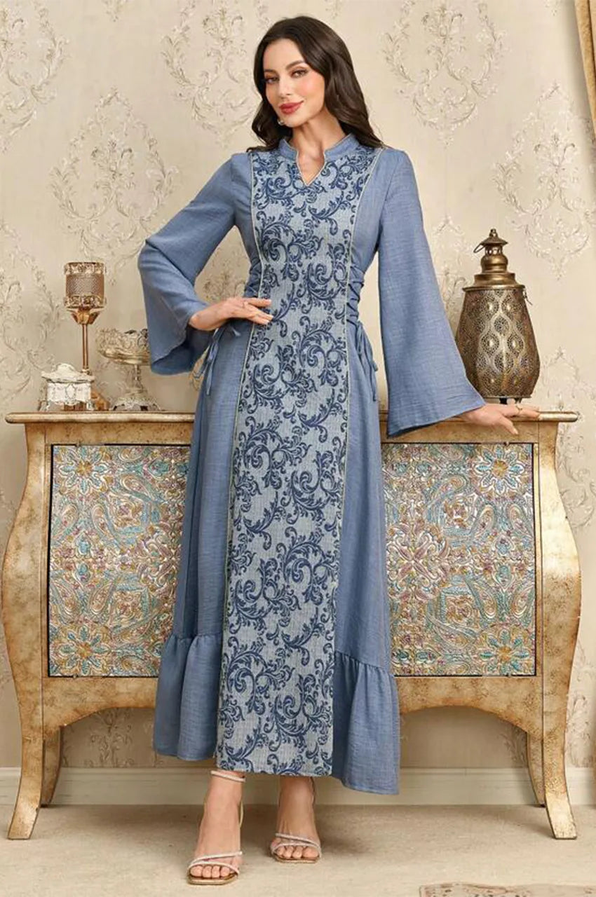 Elegant lifestyle shot of the Lumis light blue kaftan styled for a formal occasion.