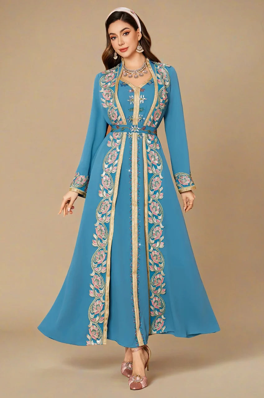 Detailed view of the central embroidered panel on the luxury blue floral kaftan.