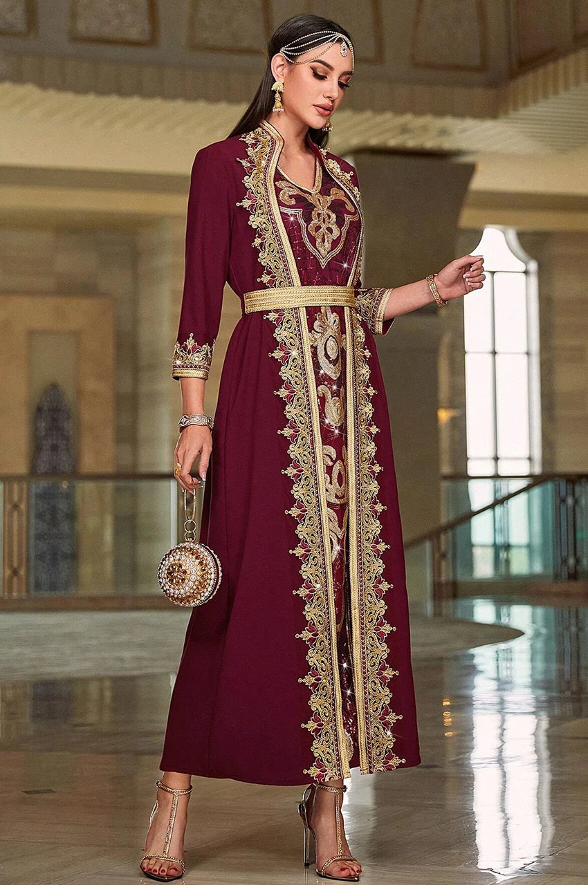 Luxury burgundy chiffon kaftan abaya featuring royal gold Sfifa trim and metallic embroidery.
