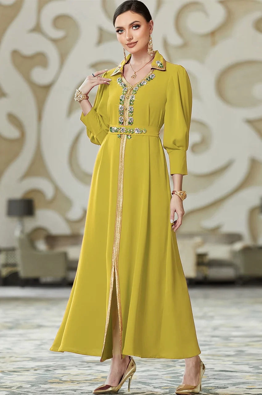 Model wearing the luxury Karia green orient kaftan made of fluid crepe fabric, designed for formal evening parties.