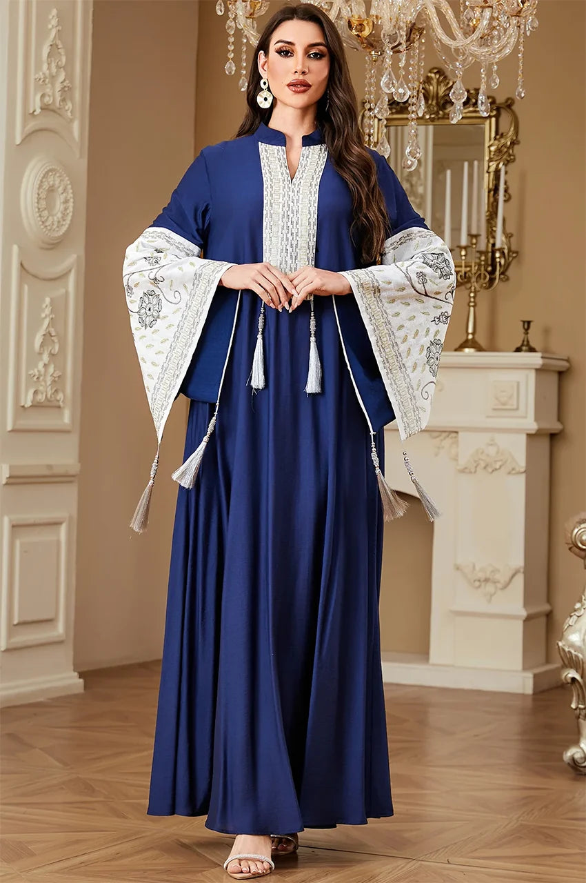 Lifestyle shot of the Navy Blue Nairi cotton kaftan maxi in a luxury setting, showcasing its elegant Moroccan-inspired design