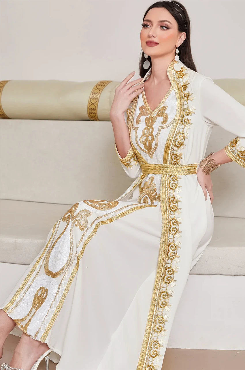 Seated lifestyle photo of the white chiffon kaftan dress, ideal for high-end modest fashion.