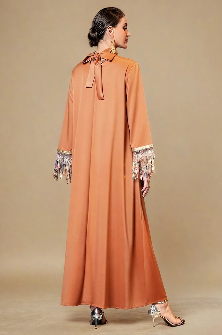 Back view of Luzia orange fringed kaftan with bow tie neck