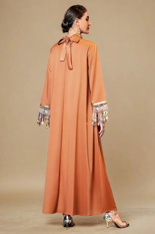 Back view of Luzia orange fringed kaftan with bow tie neck
