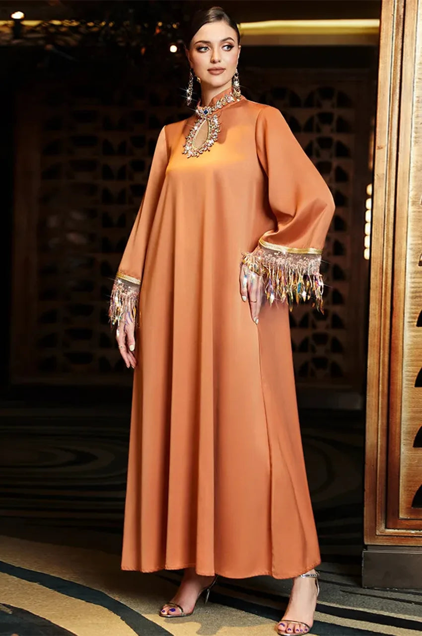 Full-length view of Luzia burnt orange fringed kaftan dress