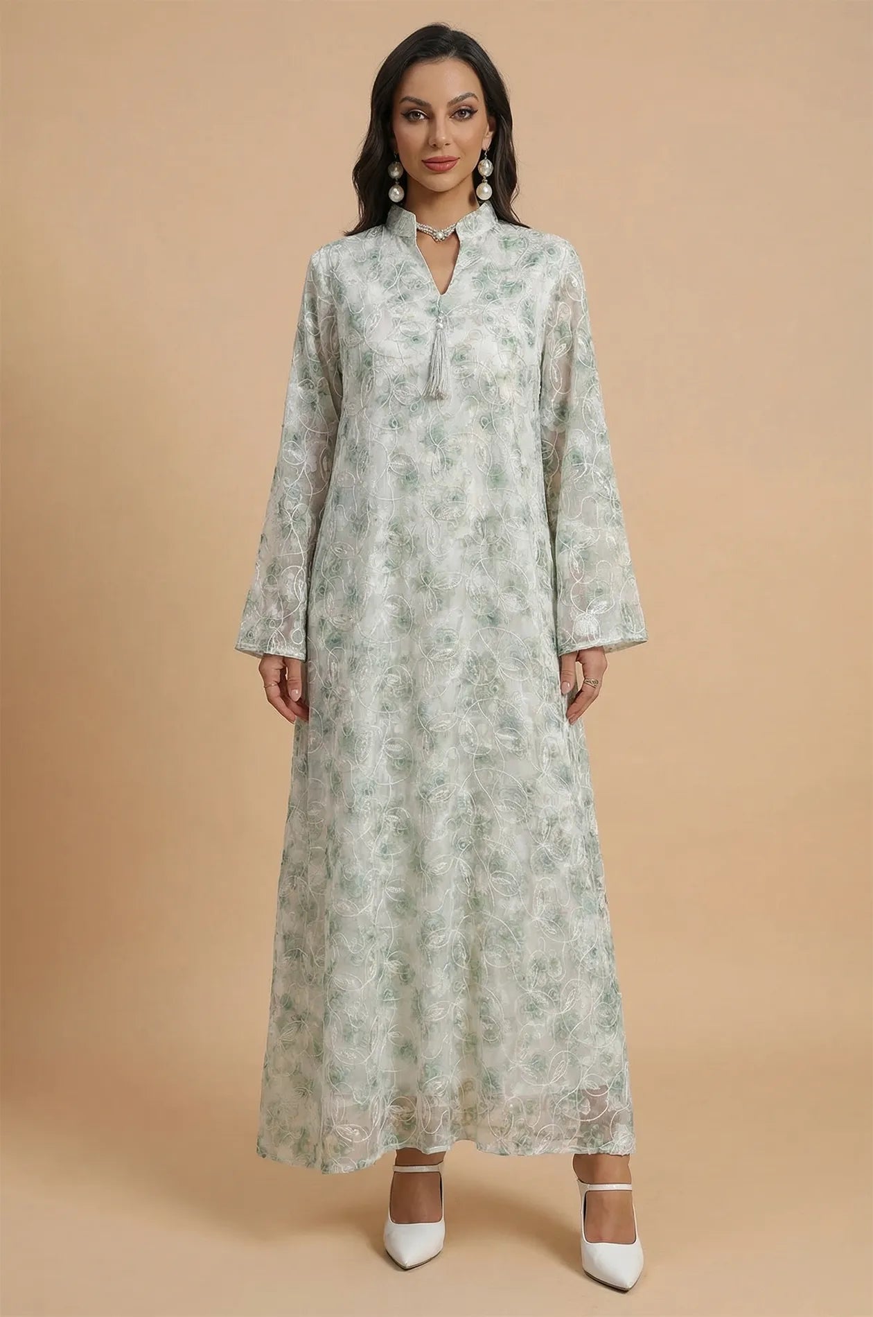 Front full-length view of the Lyana light green kaftan with floral embroidery.