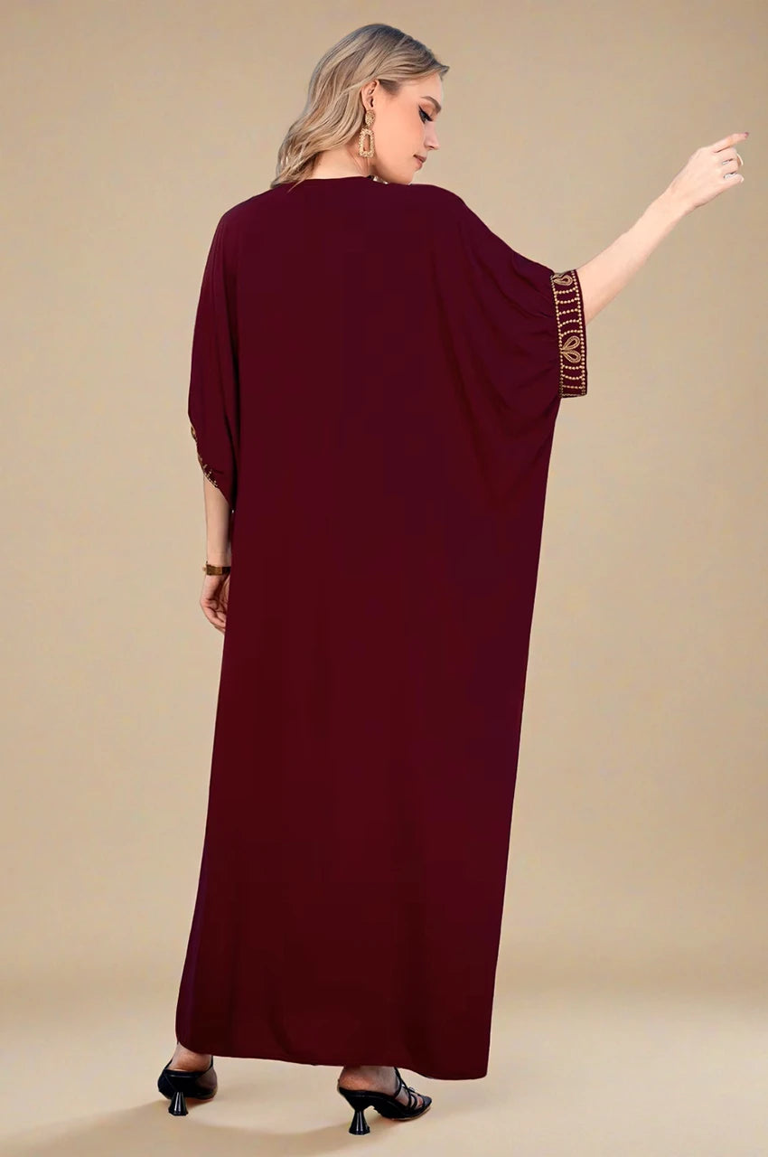 Back-side angle of Maela Chocolate Kaftan showing relaxed drape