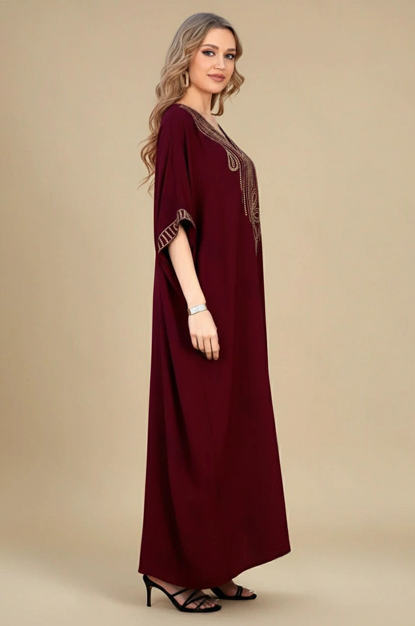 Side view of Maela Chocolate Kaftan with flowing silhouette