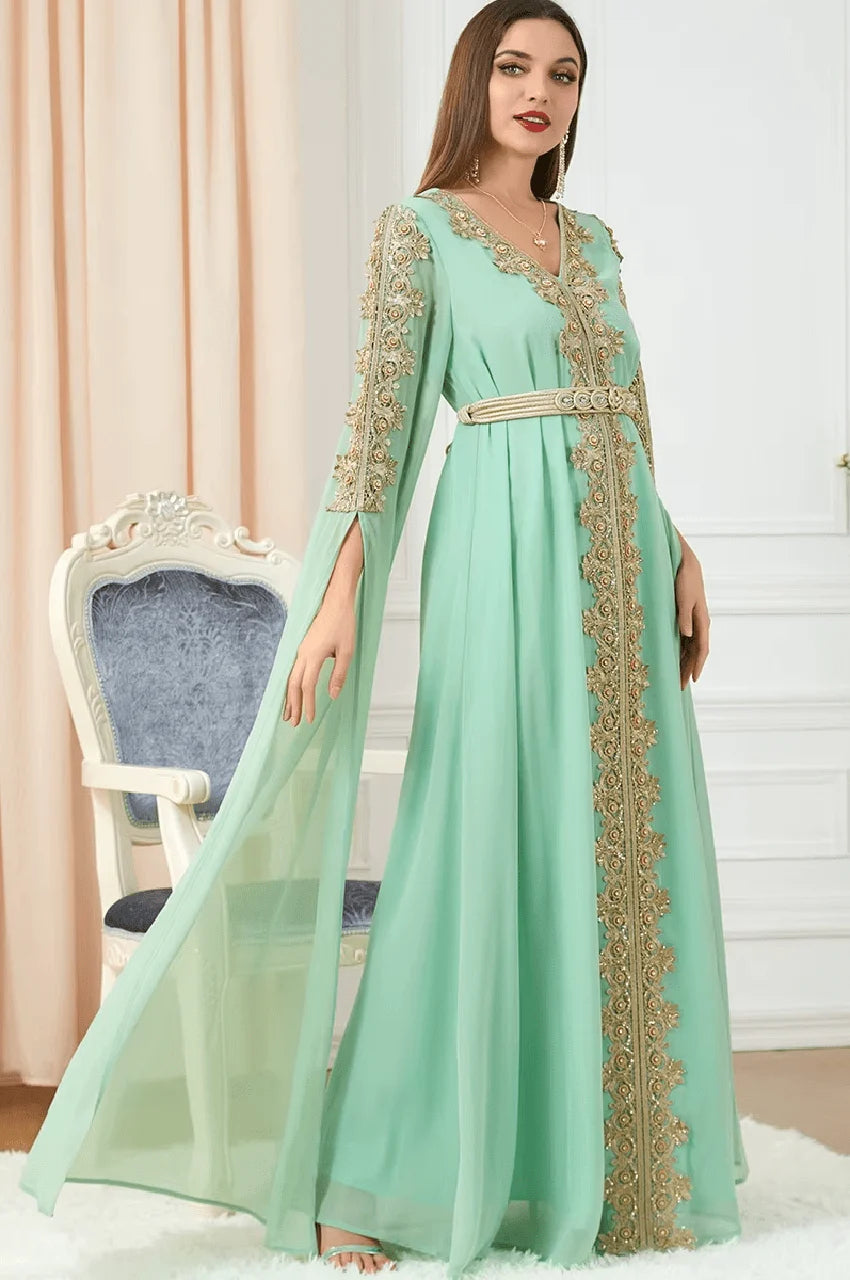 Full-length shot of Maelis green Moroccan traditional kaftan with floral gold detailing