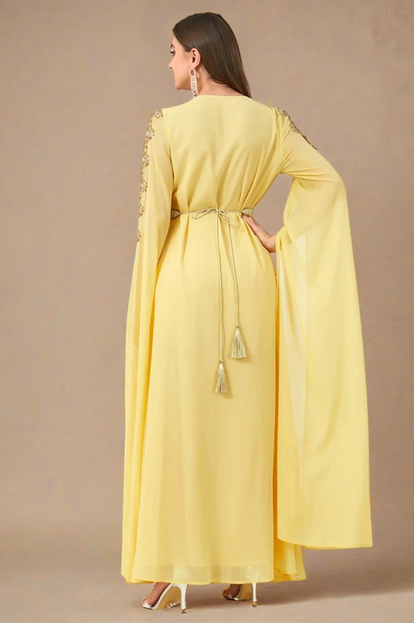 Maelis yellow Moroccan traditional kaftan back view with gold tassel belt