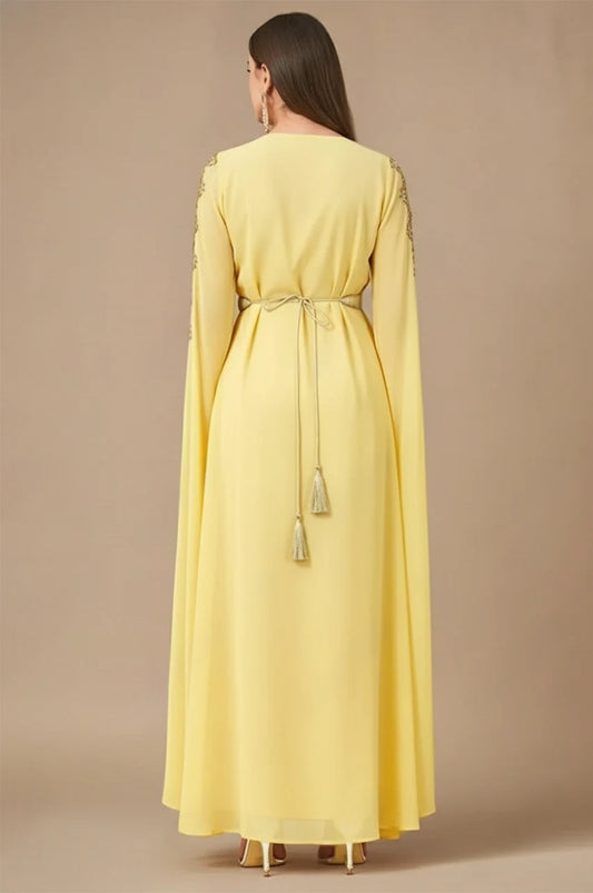 Maelis yellow Moroccan traditional kaftan back view with flowing cape sleeves