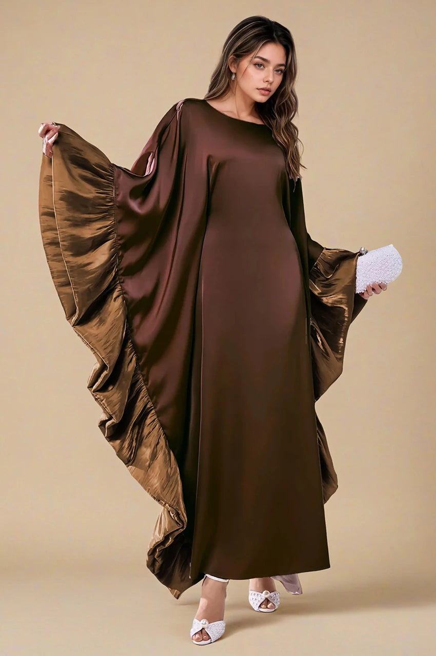 Malya brown ruffle kaftan in dramatic sleeve pose showing sculptural satin ruffles