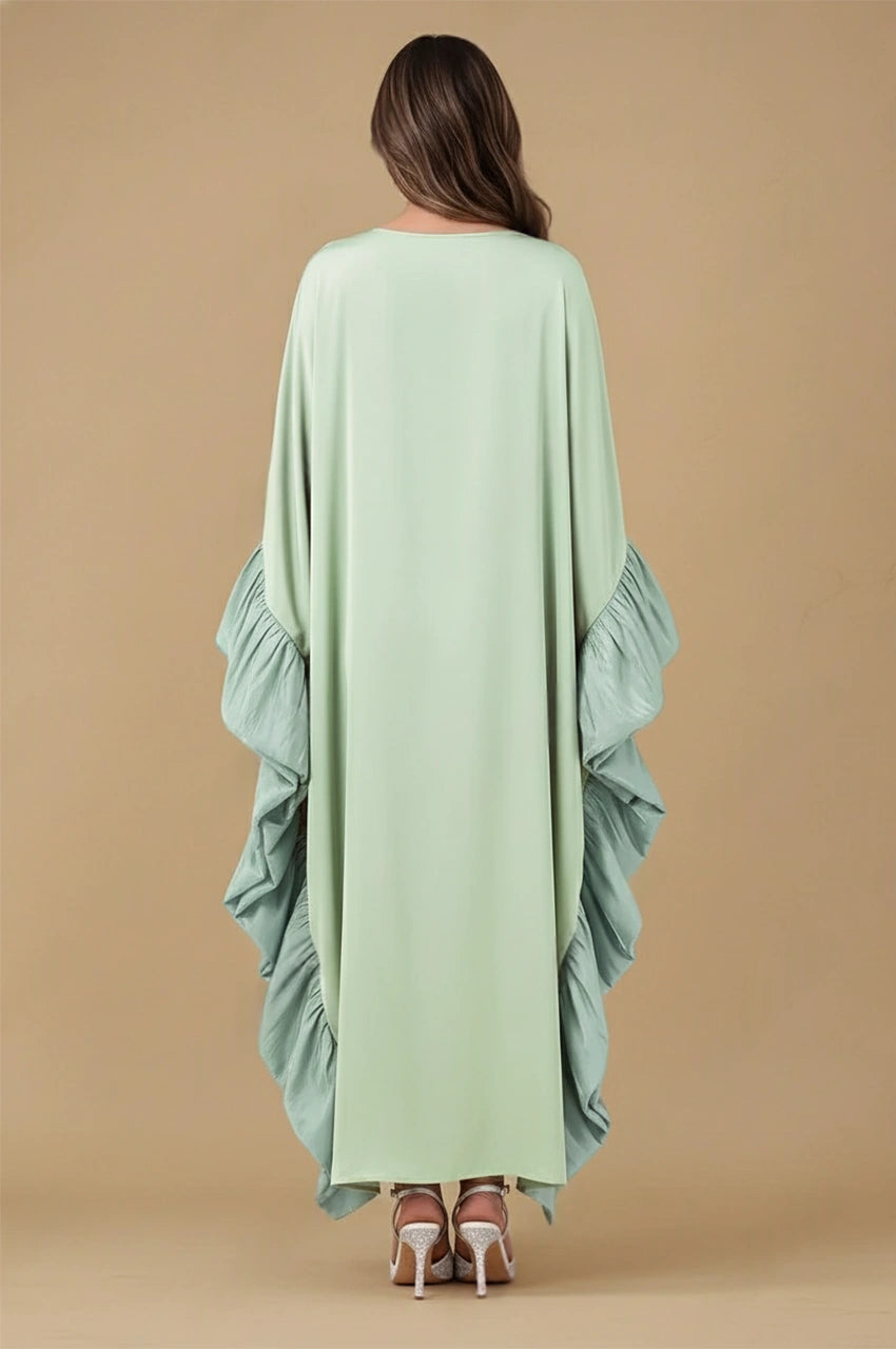 Back view of Malya green ruffle kaftan with full-length drape and soft ruffle accents
