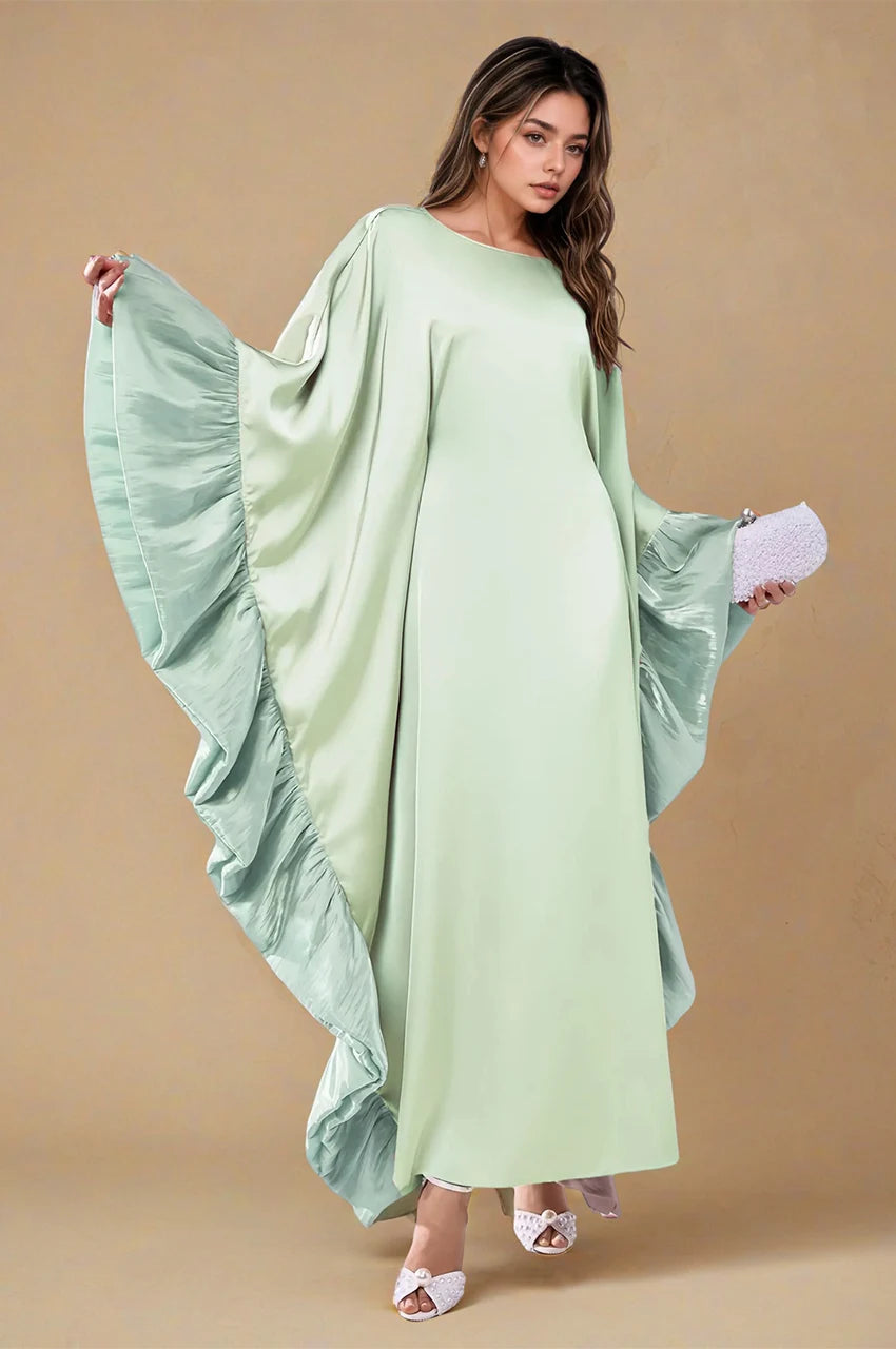 Full-length front shot of the Malya green ruffle kaftan featuring wide sleeves and layered ruffles