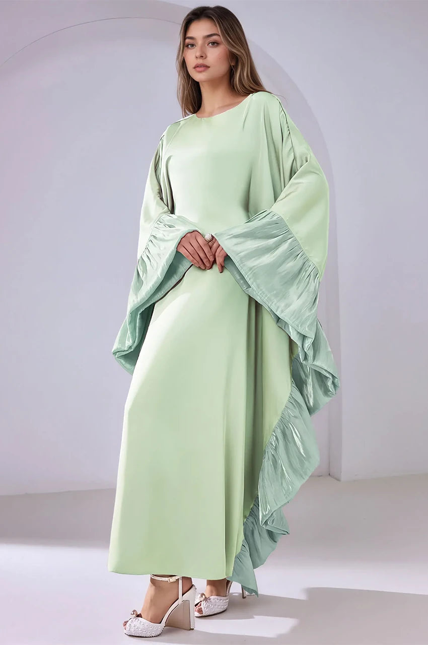Soft satin front view of the Malya green ruffle kaftan highlighting its fluid silhouette