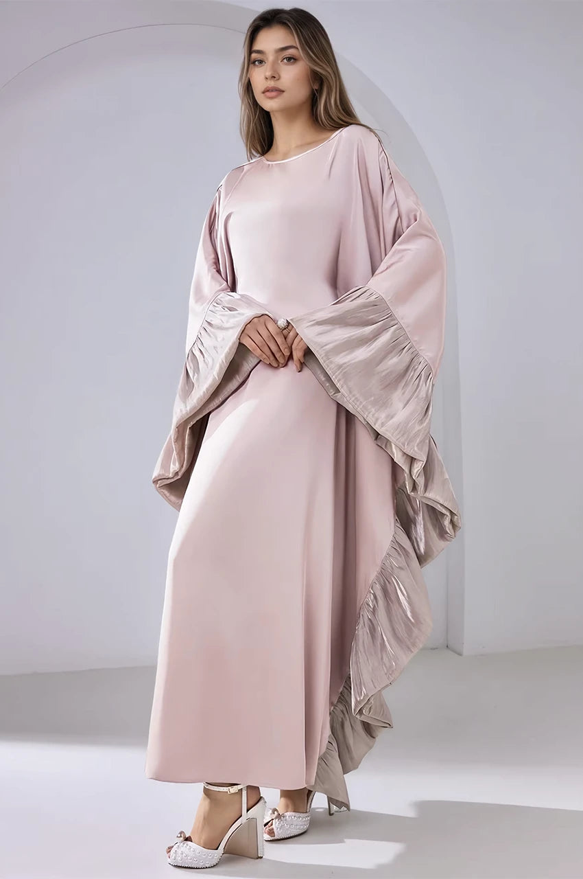 Elegant pose wearing the Malya pink ruffle kaftan with signature layered ruffles