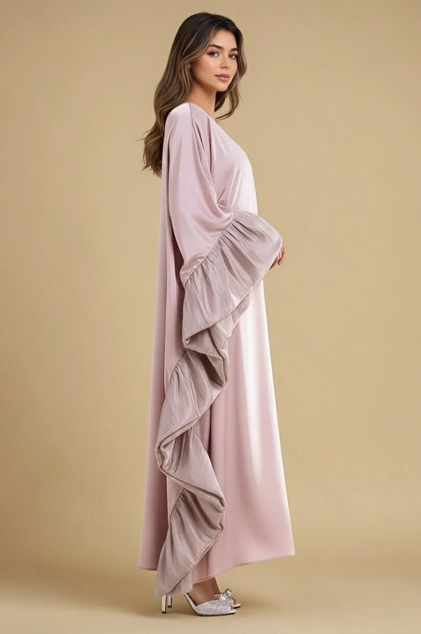 Side view of pink Malya ruffle kaftan with cascading sleeve ruffles and elegant drape