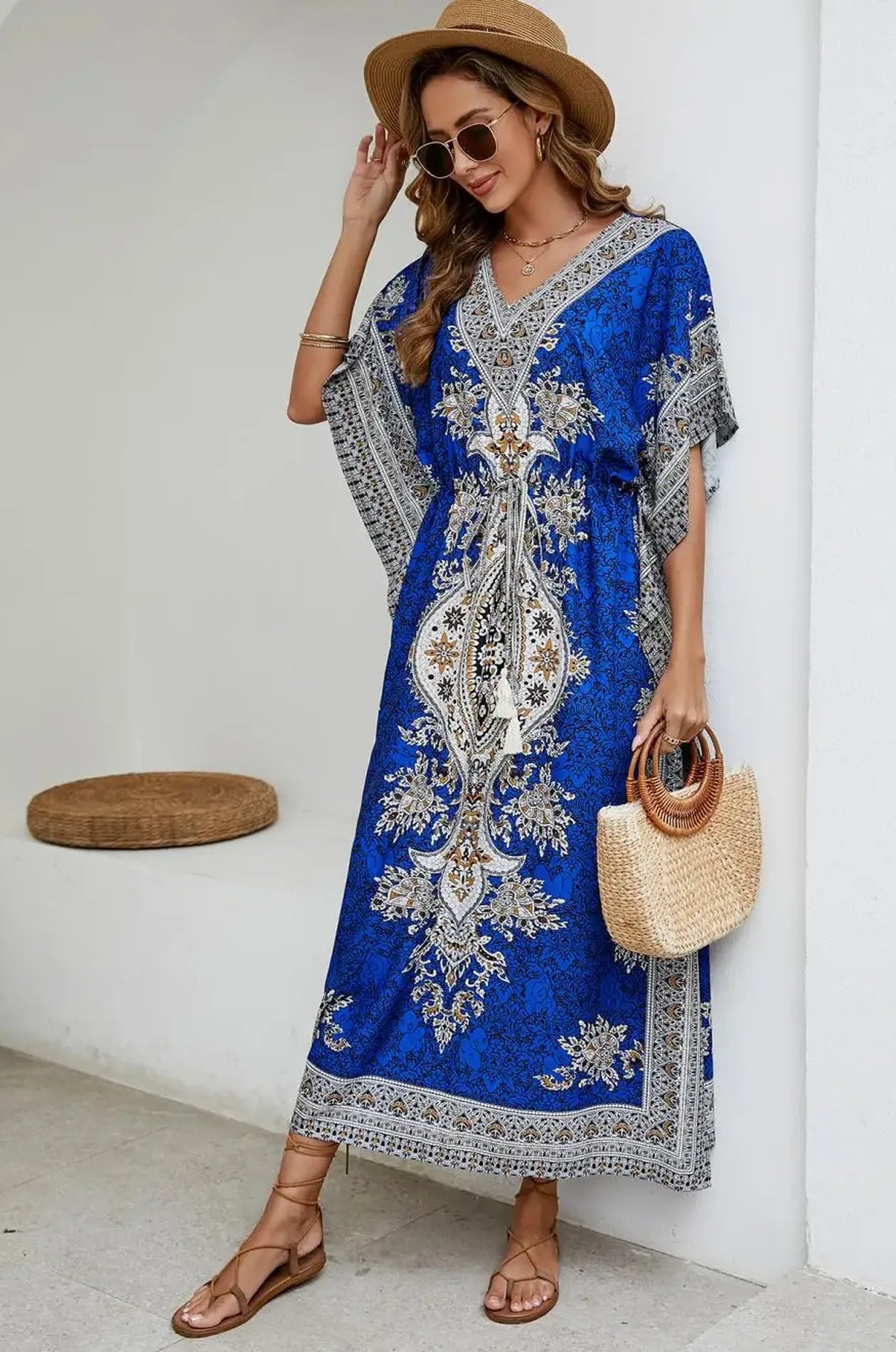 Blue boho mandala kaftan styled with straw tote and lace-up sandals