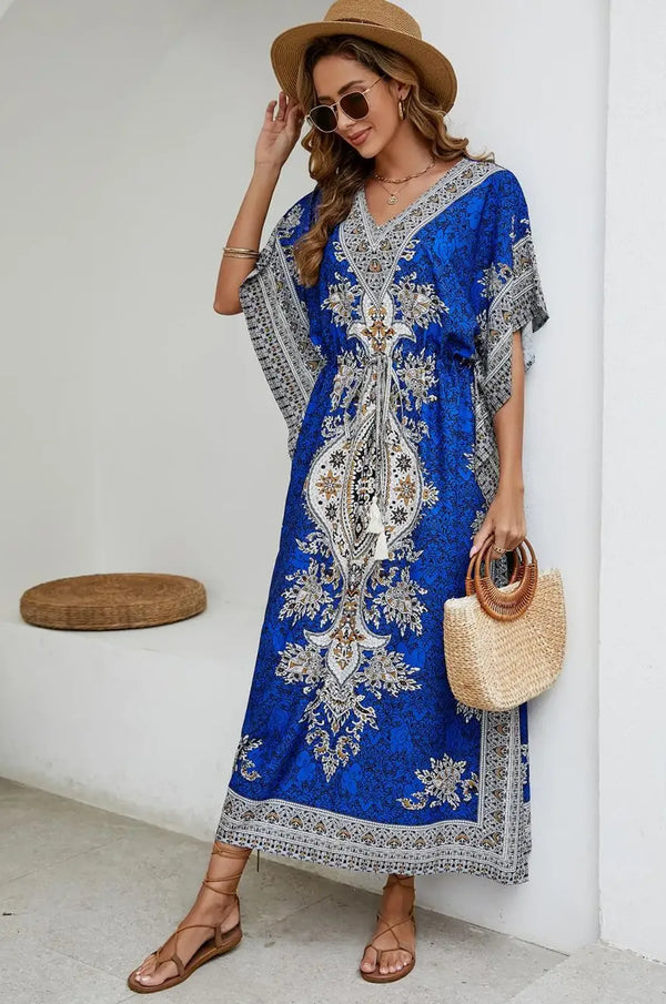 Blue boho mandala kaftan styled with straw tote and lace-up sandals