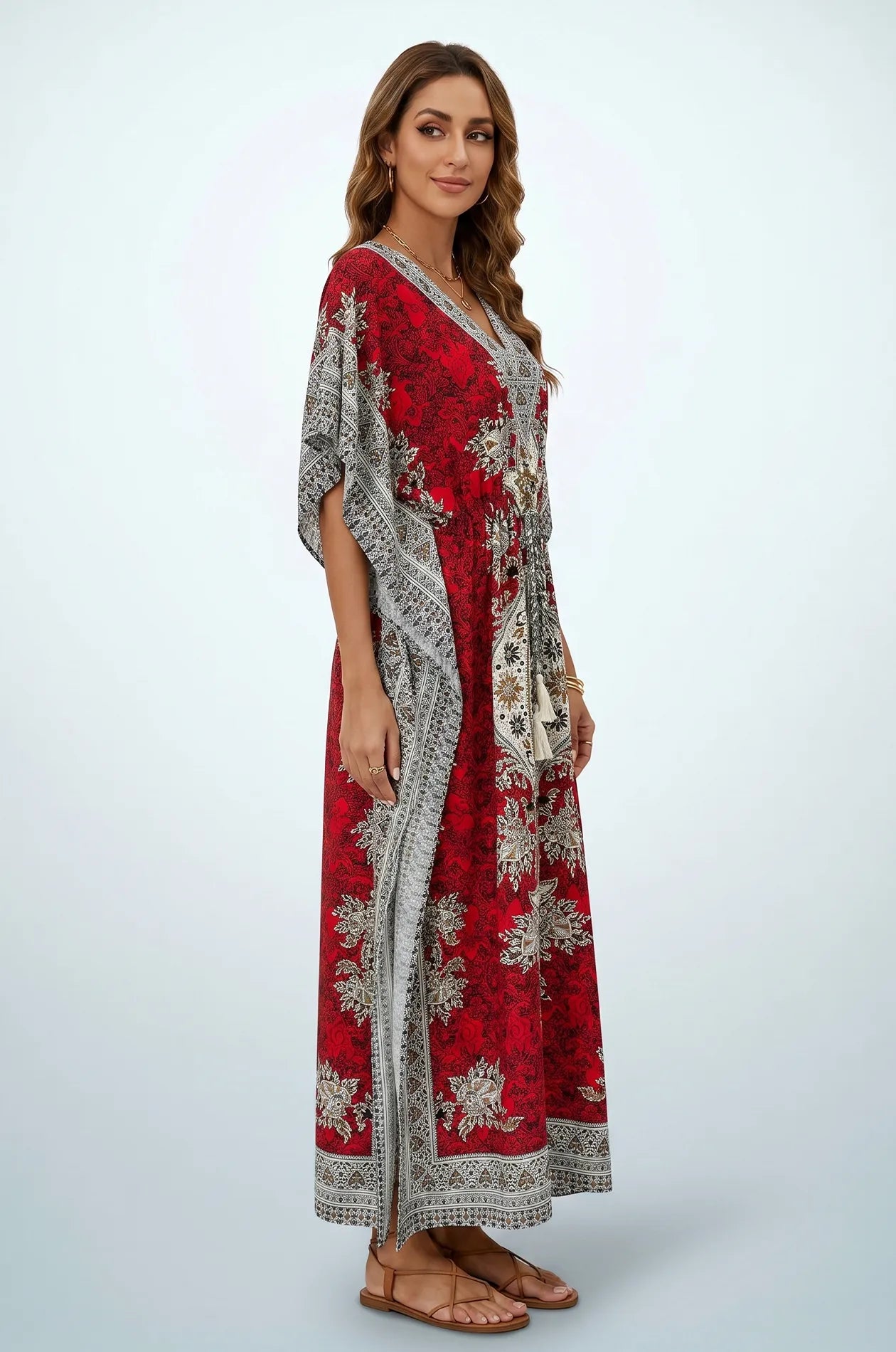 Side profile of red mandala kaftan showing flowing drape and sleeve