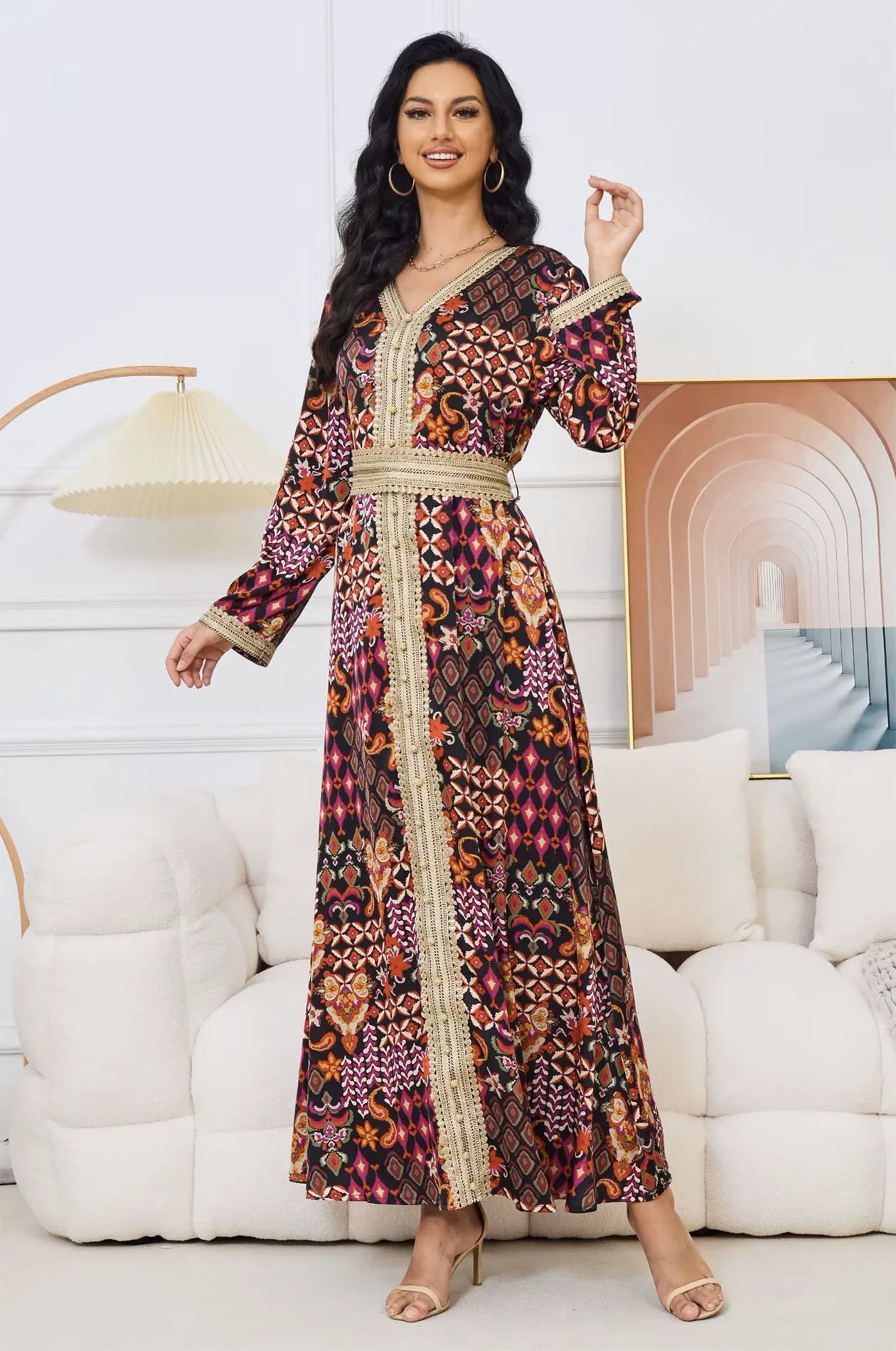 Fashion pose of the Maris tribal kaftan highlighting the flowy fabric.