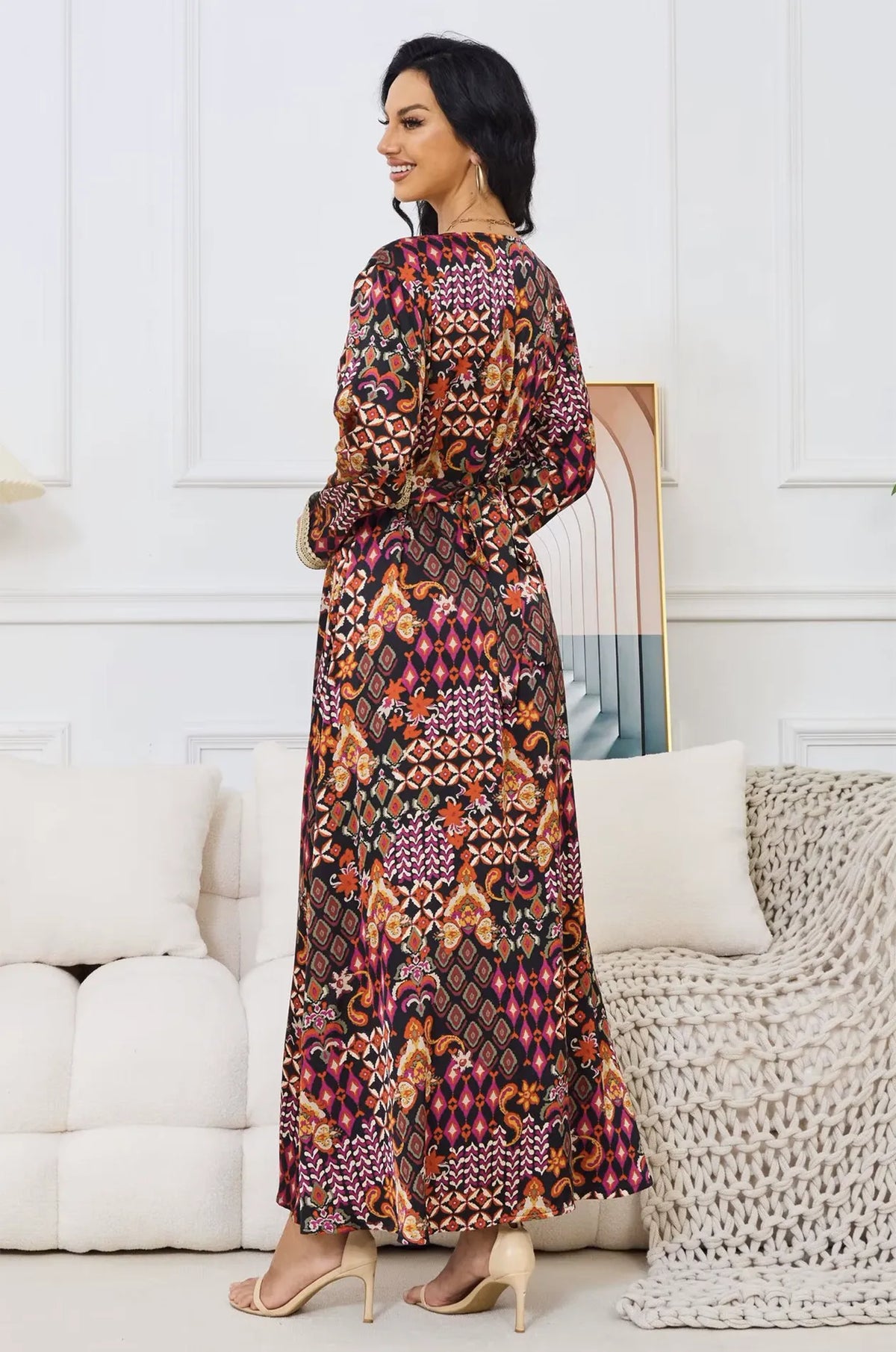 Close-up of the gold braided belt and tribal print on the Maris kaftan.