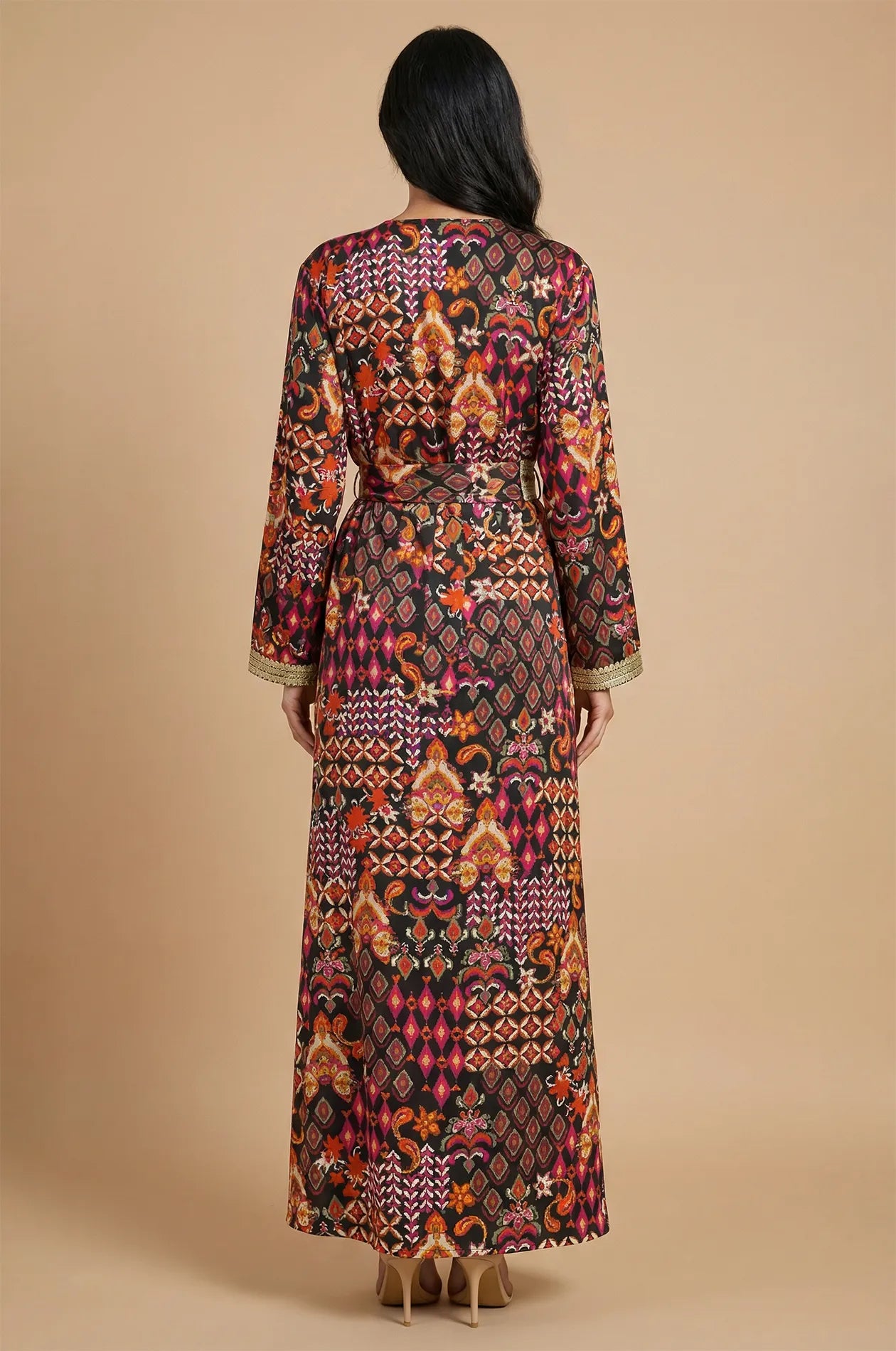 Back view of the Maris tribal kaftan showing the full-length geometric pattern.