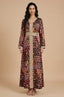 Front view of Maris Tribal Kaftan in multicolor geometric print with gold belt.