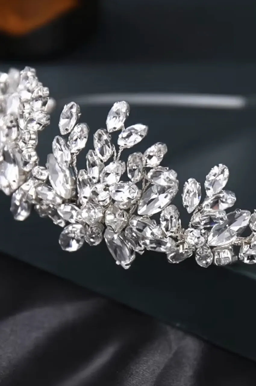Extreme close-up of marquise cut crystals and prong settings on silver bridal tiara.