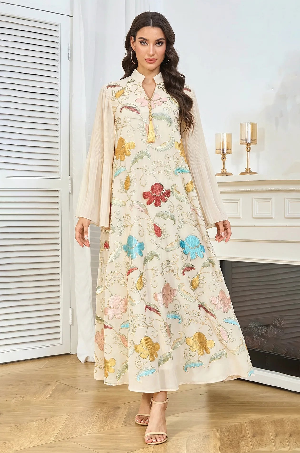 Model standing in the Marylin Beige Tassel Kaftan, showing the relaxed maxi fit and shimmering multicolored floral details.