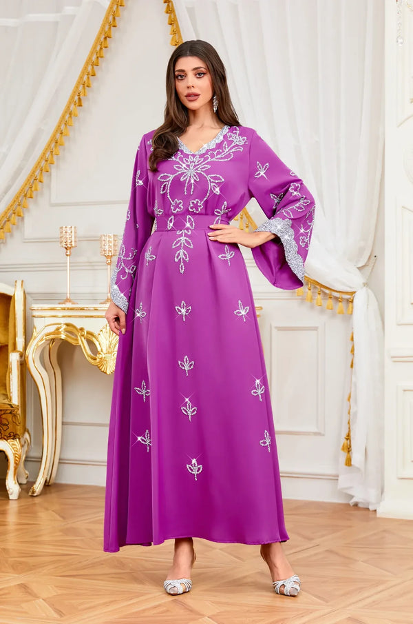 Mid-shot of the Maya Magenta Kaftan showcasing the elegant flared sleeves and silver embellishments.