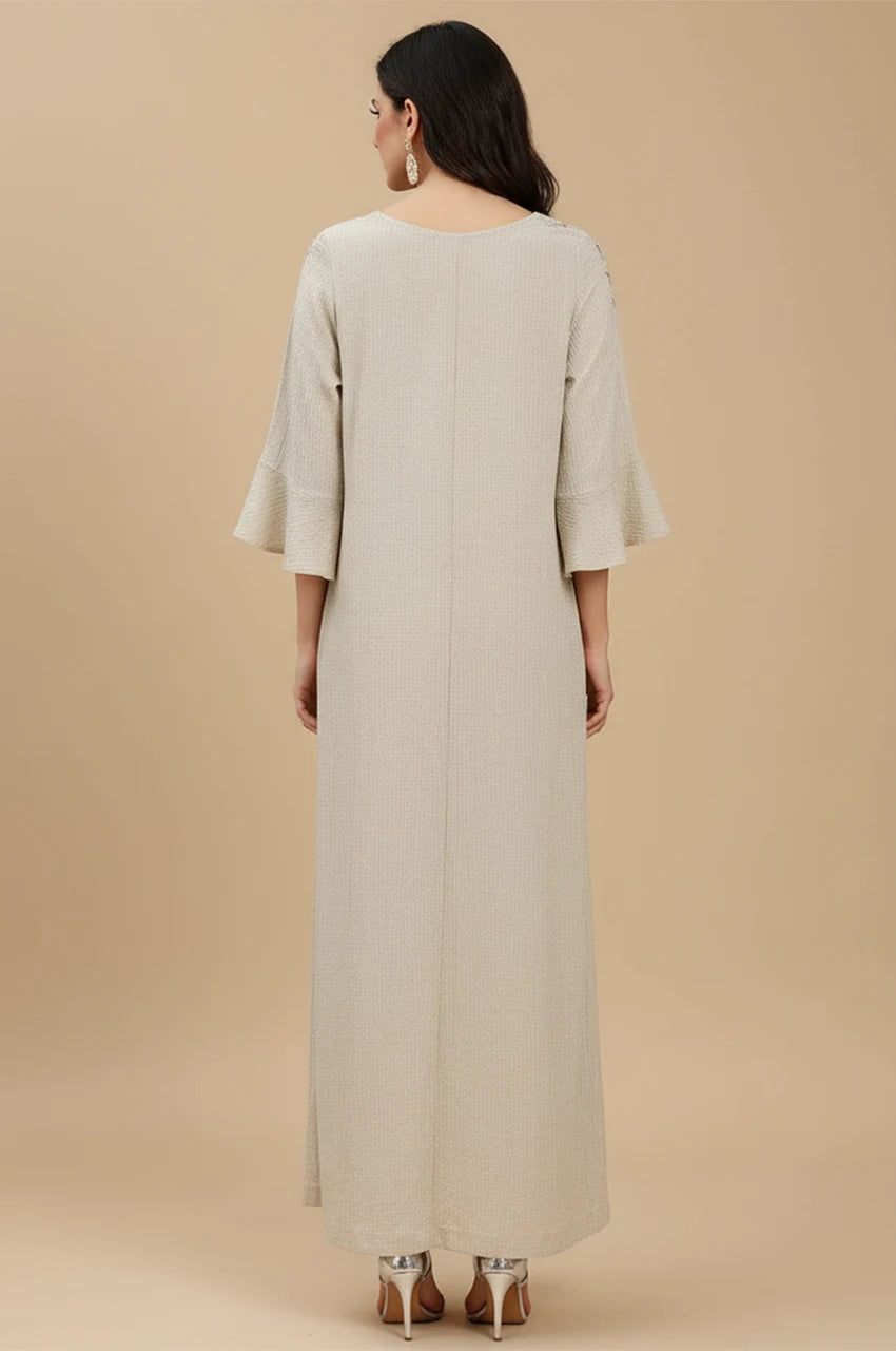 Back view of the Meira shimmering kaftan dress showing flowy A-line cut.