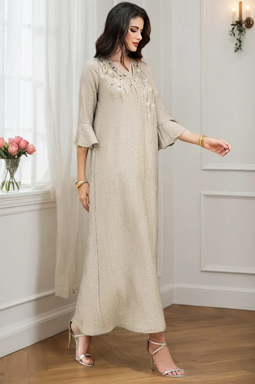 Full length shot of Meira formal kaftan gown in motion showing fabric fluidity.