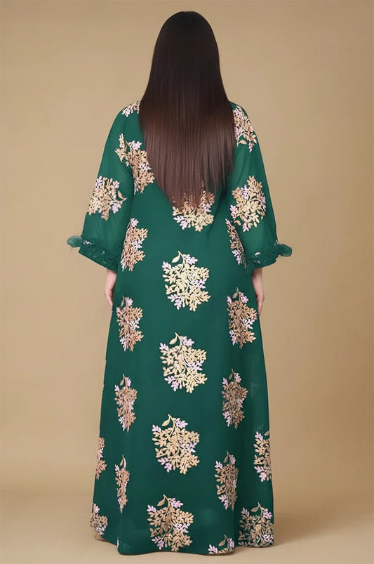 Back view of emerald green Mhaya feather sleeve kaftan with all-over gold floral embroidery