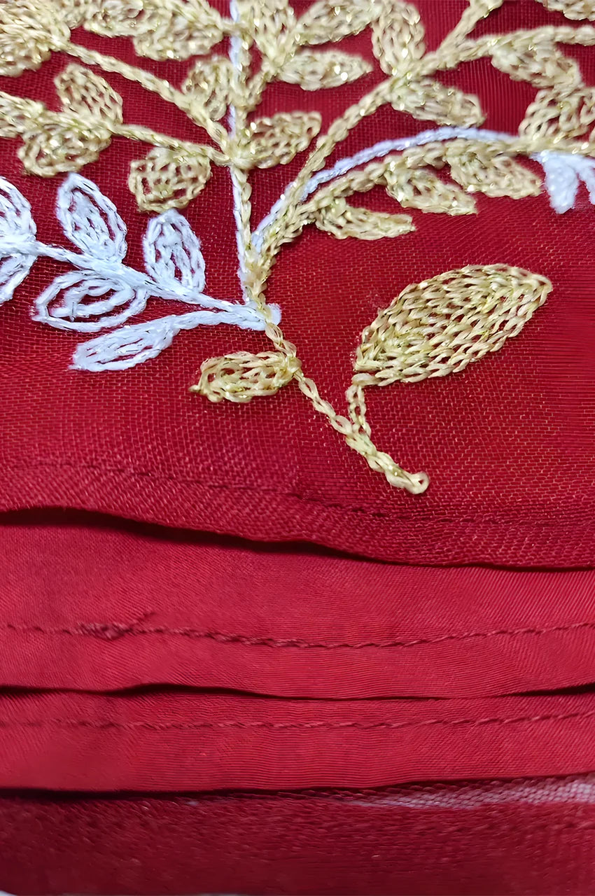 Feather-trim sleeve with metallic leaf embroidery on the Mhaya garnet feather-sleeve kaftan.